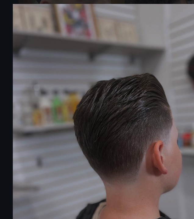 Slick back with fade by Hozan